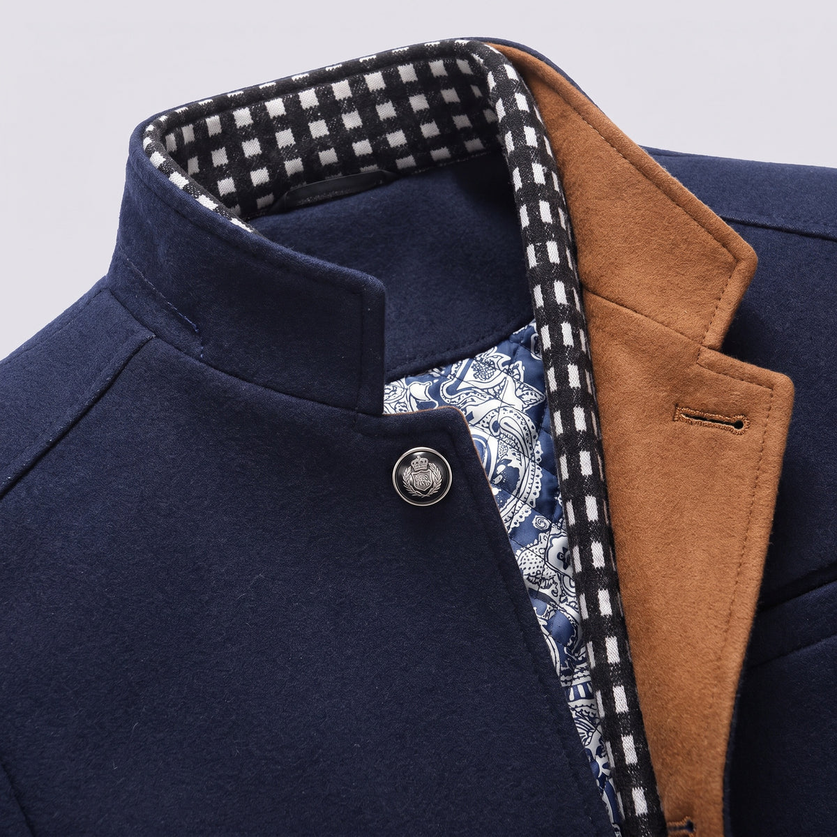 Close view of the stand collar, check inner collar and quilted lining of the coat