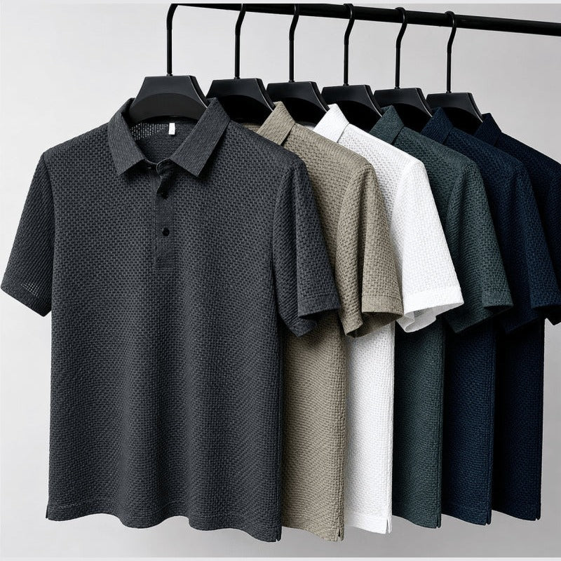 Six colours of the textured polo shirt hanging together on a rail