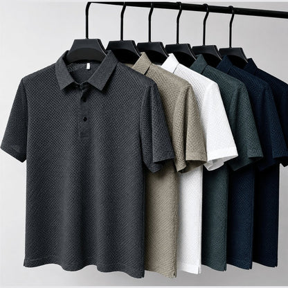Six colours of the textured polo shirt hanging together on a rail