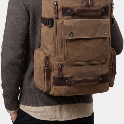 Nolan backpack worn on the back with a knit sweater