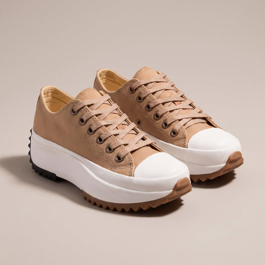Tan canvas platform sneakers with a white sole and saw-tooth tread, pair view