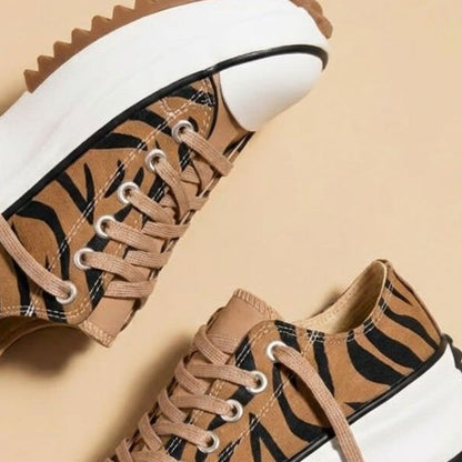 Close view of the tiger stripe print panel on the sneaker