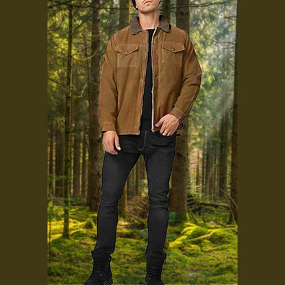 Man among tall trees wearing the brown jacket with a plush collar