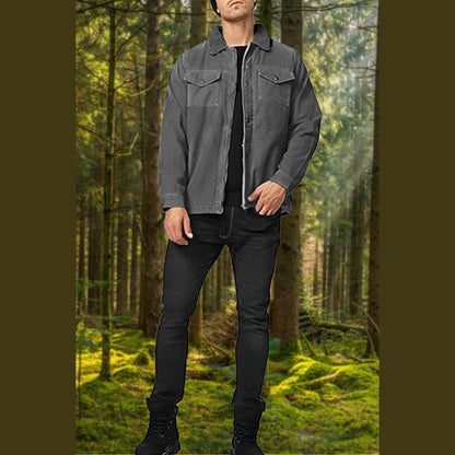 Man among tall trees wearing the grey jacket with two chest pockets