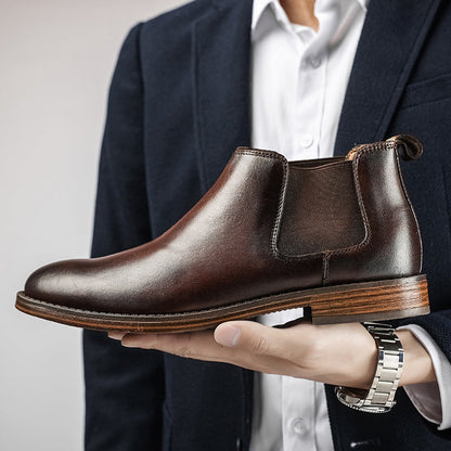 Preston chelsea boot held up beside a suit jacket