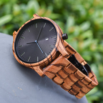 Rutledge walnut wood watch outdoors with the link band curled