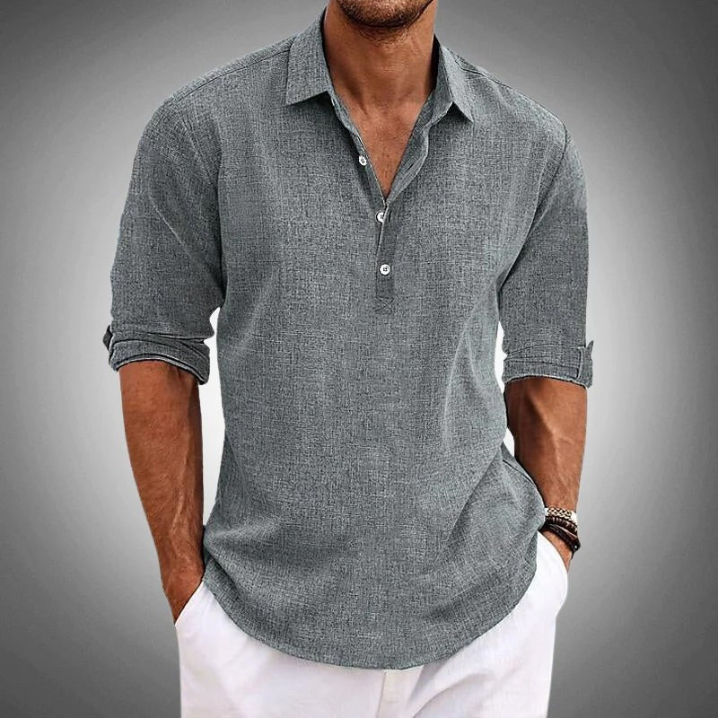 Gray textured henley worn with white trousers, cropped below the chin