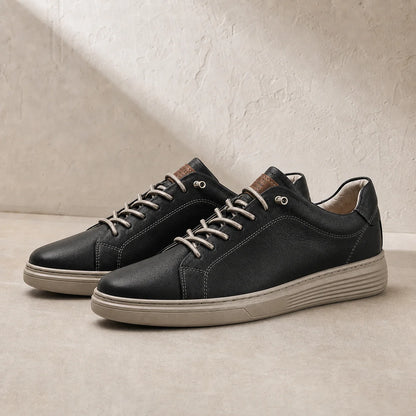 Torino Leather Trainers in Black on clean studio stone