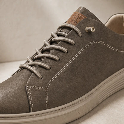 Close-up of Torino Leather Trainers laces stitching and leather texture