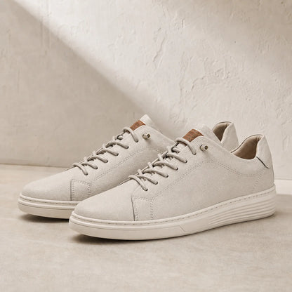 Torino Leather Trainers in White on clean studio stone