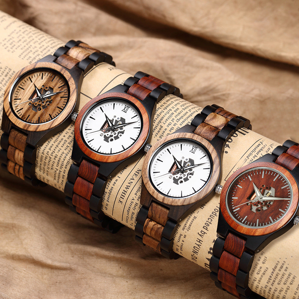 Four Whitmore wooden watches in different wood tones on a roll