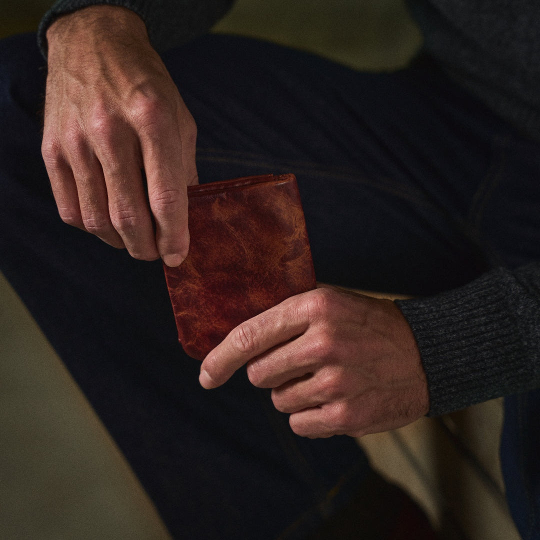 Zachary wallet being drawn from the hand