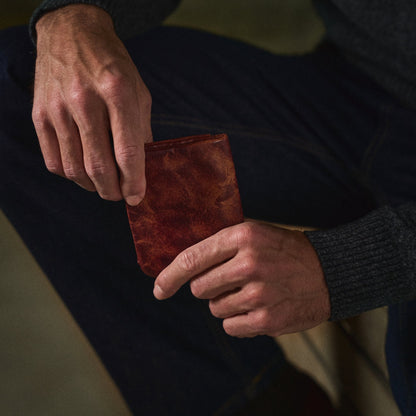 Zachary wallet being drawn from the hand
