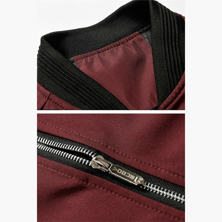 Close views of the ribbed collar and the metal zip on the dark red jacket