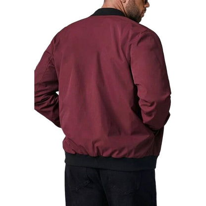 Back of the dark red bomber jacket worn by a man with a ribbed hem