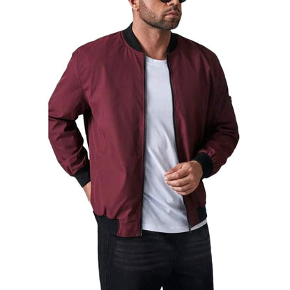 Man wearing the dark red bomber jacket zipped over a white tee
