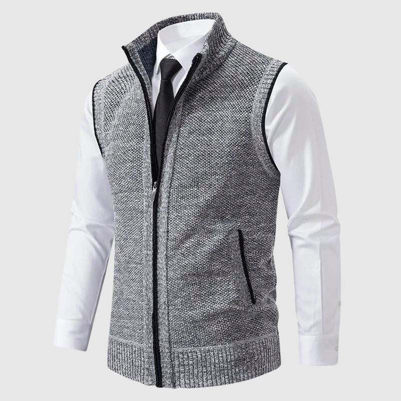Gray speckled zip-up knit vest worn over a white shirt and tie