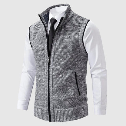 Gray speckled zip-up knit vest worn over a white shirt and tie