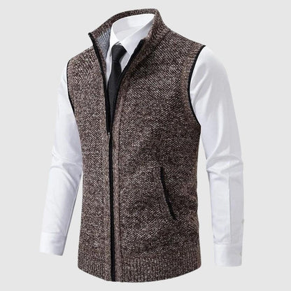 Brown speckled zip-up knit vest worn over a white shirt and tie